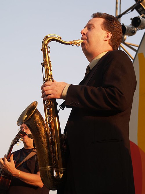 photo of saxophonist Harry Allen playing the sax on stage