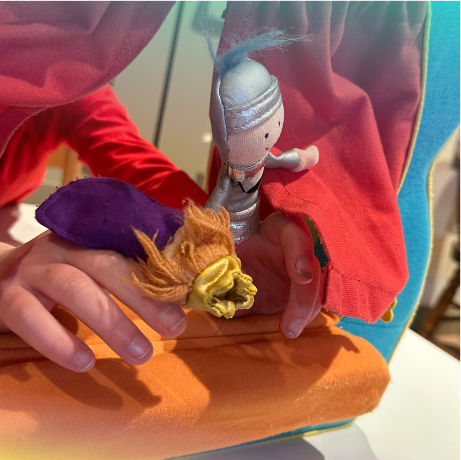 photo of children with finger puppets