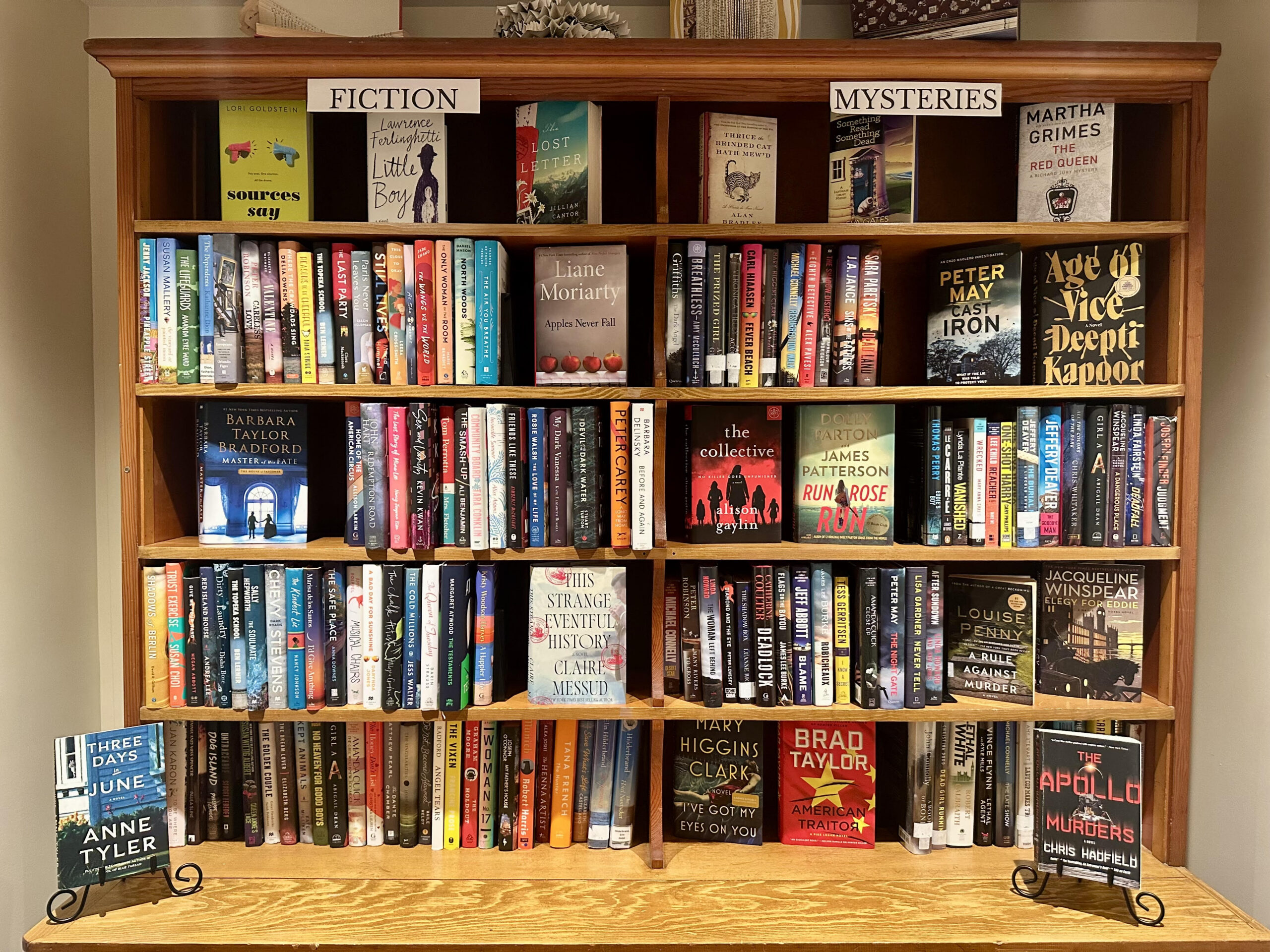 a color photo of a full bookshelf at the second time around store at West Falmouth Library