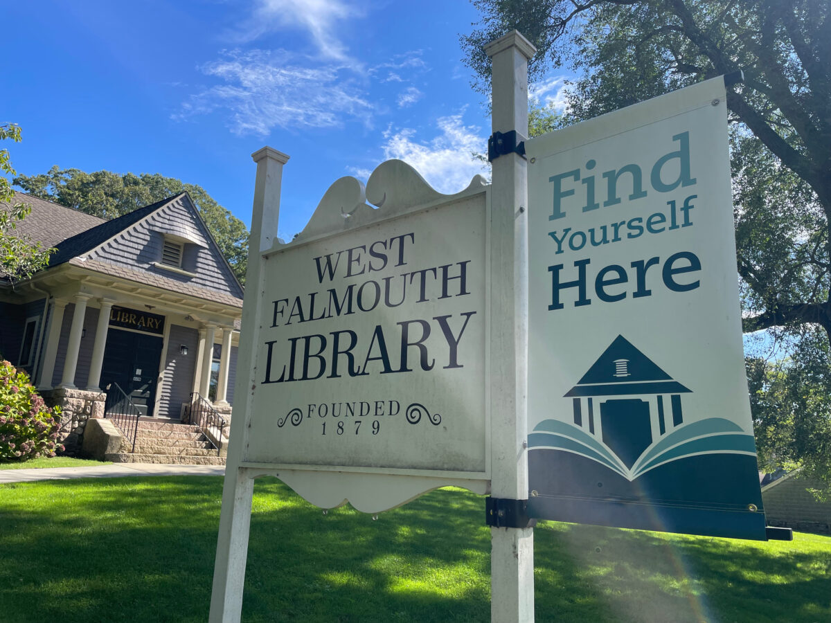 exterior daytime shot of West Falmouth Library with sign in the forefront