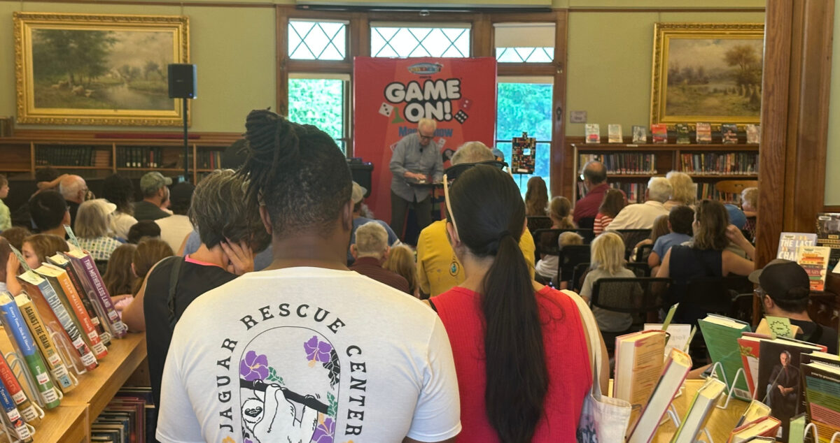 audience at magic show at west Falmouth Library