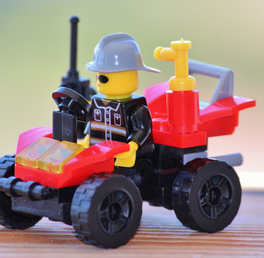 Photo of a Lego Man in a Lego Jeep