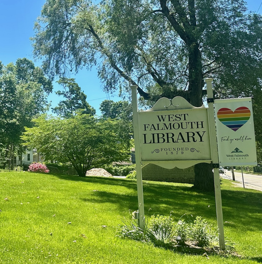 exrerior photo of West Falmouth Librayr sign with rainbow heart