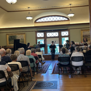 Members of the College Light Opera Company of Cape Cod, Massachusetts USA, performing at West Falmouth Library