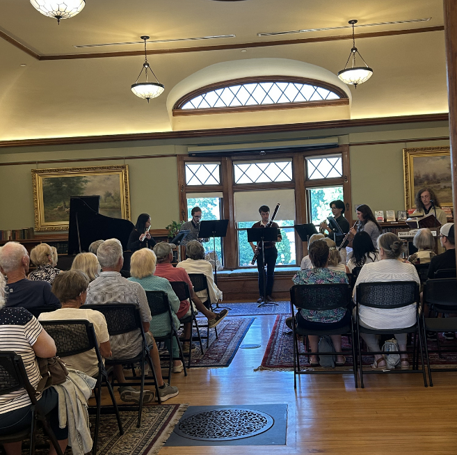 Members of the College Light Opera Company of Cape Cod, Massachusetts USA, performing at West Falmouth Library