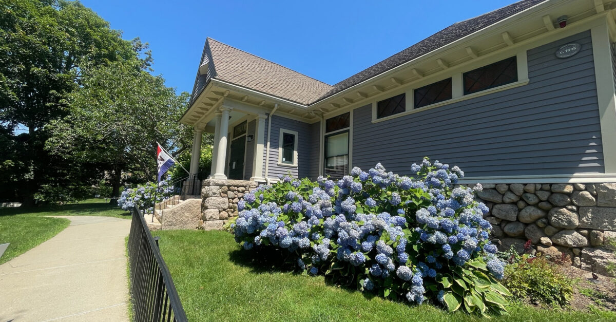 exterior photo of west Falmouth Library front entrance during a sunny day