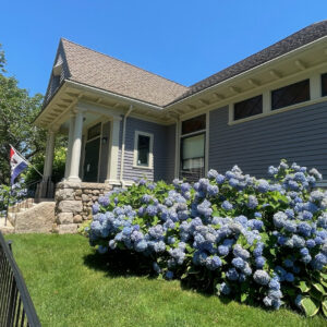 exterior photo of west Falmouth Library front entrance during a sunny day