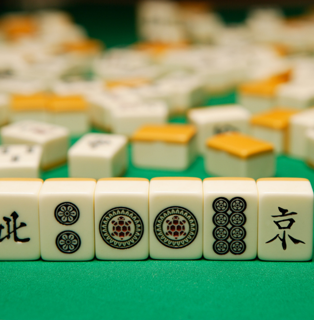 photo of a Mahjong game with tiles